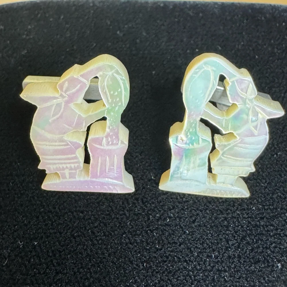 Vintage men’s carved mother of pearl cufflinks of women pouring grain